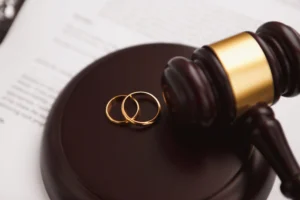 2 gold wedding rings depicted in a legal context, representing divorce law in Singapore.