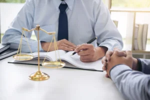 Family lawyer in Singapore reviewing legal documents with a client during a consultation at a family law firm